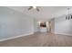 Expansive living space with wood floors, blending seamlessly into the kitchen area at 7983 Limestone Ln # 14-201, Sarasota, FL 34233