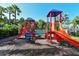 Fun community playground area with slides, climbing structures, and a safe, open play space at 7983 Limestone Ln # 14-201, Sarasota, FL 34233