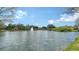 Scenic pond view with a fountain and lush landscaping, enhancing the community's charm at 7983 Limestone Ln # 14-201, Sarasota, FL 34233
