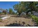 Spacious backyard featuring mature trees and plenty of space for outdoor activities at 8225 Drew St, Englewood, FL 34224