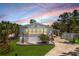 Charming single-story home with well-manicured lawn and inviting curb appeal at 8225 Drew St, Englewood, FL 34224