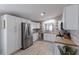 Modern kitchen with stainless steel appliances, white cabinetry and butcher block countertops at 8225 Drew St, Englewood, FL 34224