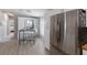 Bright kitchen with stainless steel refrigerator, white cabinets, and a charming breakfast bar area at 8225 Drew St, Englewood, FL 34224