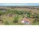 Expansive acreage estate featuring an inviting pool and fenced yard in a serene, private setting at 8280 Ibis St, Sarasota, FL 34241