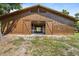 Exterior of spacious barn with sliding doors, perfect for livestock or storage at 8280 Ibis St, Sarasota, FL 34241