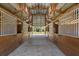 Spacious interior of the barn featuring open stalls and a clear view to the outdoors at 8280 Ibis St, Sarasota, FL 34241