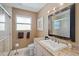 This bathroom has a modern sink and shower, plus a large mirror and window at 8280 Ibis St, Sarasota, FL 34241