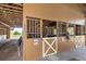 Horse stall features a brown equine occupant, offering a comfortable, secure space with access to the outdoors at 8280 Ibis St, Sarasota, FL 34241