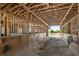 Indoor horse stalls feature wooden construction and open-air design, providing ample space for livestock and ventilation at 8280 Ibis St, Sarasota, FL 34241