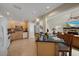 Open kitchen with a breakfast bar, stainless steel appliances, and ample cabinets at 8280 Ibis St, Sarasota, FL 34241