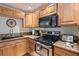 The kitchen features stainless steel appliances, granite countertops, and wood cabinets at 8280 Ibis St, Sarasota, FL 34241