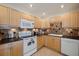 Well-equipped kitchen featuring stainless appliances and tiled backsplash at 8280 Ibis St, Sarasota, FL 34241