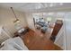 Aerial view of the living area with hardwood floors, staircase, and comfortable seating at 8280 Ibis St, Sarasota, FL 34241