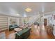 Bright living room with hardwood floors, built-in shelves, and staircase leading to the second floor at 8280 Ibis St, Sarasota, FL 34241