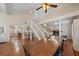 Spacious living area with hardwood floors, fireplace, and open layout to other rooms at 8280 Ibis St, Sarasota, FL 34241