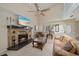 Cozy living room with a stone fireplace and ample seating at 8280 Ibis St, Sarasota, FL 34241