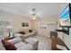 Cozy living room with tile floors, large windows, and comfortable seating at 8280 Ibis St, Sarasota, FL 34241