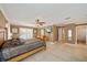 The main bedroom features an exterior door, dresser with mirror, and ceiling fan at 8280 Ibis St, Sarasota, FL 34241