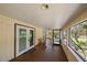 An expansive, covered back porch, enhanced by the calming view at 8280 Ibis St, Sarasota, FL 34241