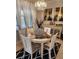 Cozy dining area with a round table, stylish chairs, and elegant decorations at 9011 Hammock Edge Pl, Bradenton, FL 34212