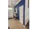 Inviting foyer with tile floors, elegant decor, and a staircase leading to the upper level at 9011 Hammock Edge Pl, Bradenton, FL 34212