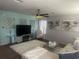 Comfortable living room with stylish decor, a ceiling fan and plenty of natural light at 9011 Hammock Edge Pl, Bradenton, FL 34212