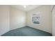 Calming bedroom including a ceiling fan and natural lighting through a large window at 9238 13Th Avenue Nw Cir, Bradenton, FL 34209