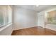 Well-lit bedroom features hardwood flooring, two windows and a closet with plenty of natural light at 9238 13Th Avenue Nw Cir, Bradenton, FL 34209