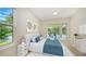 Cozy bedroom featuring a walkout to the pool, a beautiful view and soft, neutral colors at 9238 13Th Avenue Nw Cir, Bradenton, FL 34209