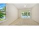 A simple bedroom with a slider to the pool area, and an eye-pleasing view out of the window at 9238 13Th Avenue Nw Cir, Bradenton, FL 34209
