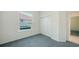 Simple bedroom with a double door closet and a natural view out the window at 9238 13Th Avenue Nw Cir, Bradenton, FL 34209