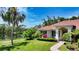 Single Gathering home has a meticulously landscaped yard, mature trees, and is located on a lake at 9238 13Th Avenue Nw Cir, Bradenton, FL 34209