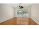 Spacious living room with hardwood flooring and sliding glass doors overlooking the pool area at 9238 13Th Avenue Nw Cir, Bradenton, FL 34209