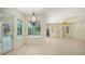 Bright living room with views of pool and outdoor screened in area at 9238 13Th Avenue Nw Cir, Bradenton, FL 34209
