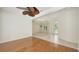 Bright living room boasts hardwood floors, white walls, a ceiling fan, and an open floor plan at 9238 13Th Avenue Nw Cir, Bradenton, FL 34209