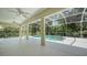 Screened-in pool and patio area with lovely view of natural surroundings, ceiling fans for comfort at 9238 13Th Avenue Nw Cir, Bradenton, FL 34209