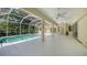 Spacious backyard with screened-in pool, covered patio, ceiling fans and lush landscaping at 9238 13Th Avenue Nw Cir, Bradenton, FL 34209