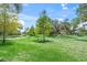 Expansive green space with mature trees, offering a serene and picturesque view at 8711 Palmer Park Cir, Sarasota, FL 34238