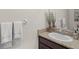 Well-lit bathroom featuring a granite countertop, undermount sink, and decorative hand towels at 8711 Palmer Park Cir, Sarasota, FL 34238