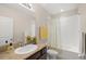 Bright bathroom featuring granite counters, a sink, and a shower and bathtub combo at 8711 Palmer Park Cir, Sarasota, FL 34238