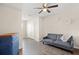 Bonus room featuring wood-look floors, a ceiling fan, and a comfortable sitting area at 8711 Palmer Park Cir, Sarasota, FL 34238