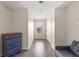 Hallway features wood-look floors, a ceiling fan, a sitting area, and a bright window at 8711 Palmer Park Cir, Sarasota, FL 34238