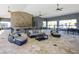 Inviting community lounge area with comfortable seating, stone details, and a convenient bar at 8711 Palmer Park Cir, Sarasota, FL 34238