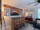 Unique bar area with custom features for relaxing and entertaining guests at 10016 Spoonbill E Rd, Bradenton, FL 34209