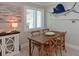 Dining area with rustic table and chairs, perfect for Gathering meals at 10016 Spoonbill E Rd, Bradenton, FL 34209