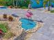 Whimsical yard art and custom design enhance this waterfront home's front yard at 10016 Spoonbill E Rd, Bradenton, FL 34209