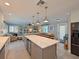 Open floor plan showcases the kitchen island flowing into the living area at 10016 Spoonbill E Rd, Bradenton, FL 34209