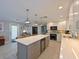 Bright kitchen features a large island, stainless appliances, and lots of storage at 10016 Spoonbill E Rd, Bradenton, FL 34209