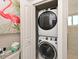 Efficient laundry area with a stacked washer and dryer setup, perfect for saving space in your home at 10016 Spoonbill E Rd, Bradenton, FL 34209