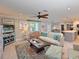 Spacious living room with waterfront views, seamlessly connected to the kitchen and dining area at 10016 Spoonbill E Rd, Bradenton, FL 34209